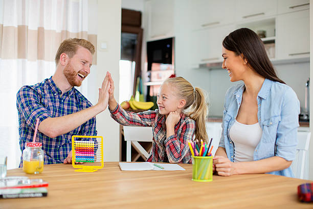 istock Girl high-fiving her dad 620714982