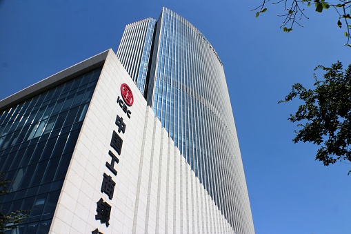 Hangzhou, China - November 4, 2016: ICBC bank corporate building on a clear blue sky from low angle.