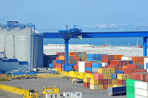 istock Port grain dryer, crane and container 620720496