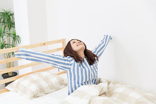 istock Japanese woman waking up 620721610