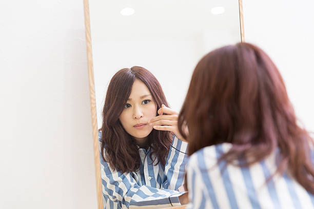 istock Japanese woman infront of mirror 620722124