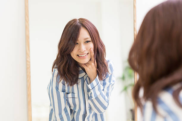 istock Japanese woman infront of mirror 620722146