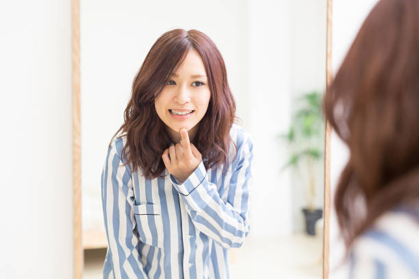 istock Japanese woman infront of mirror 620722190