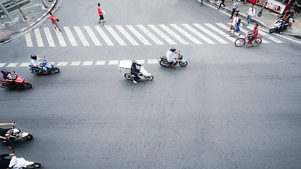 istock street on top view with people are going acroos crosswalk 620723004