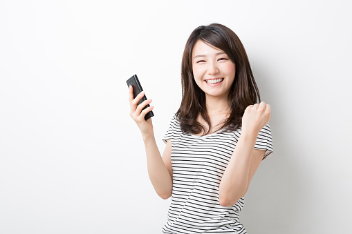 Japanese woman holding a smart phone