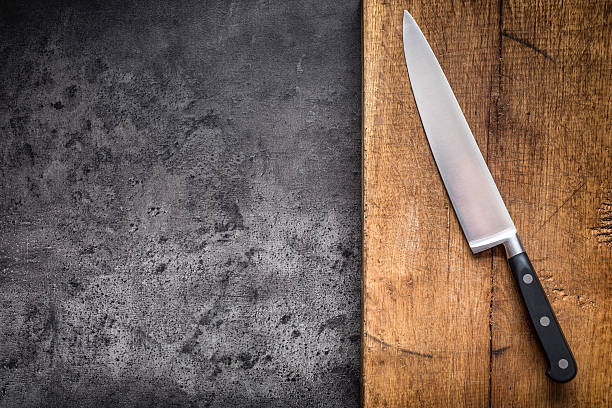 istock Kitchen knife on concrete or wooden board 620726290