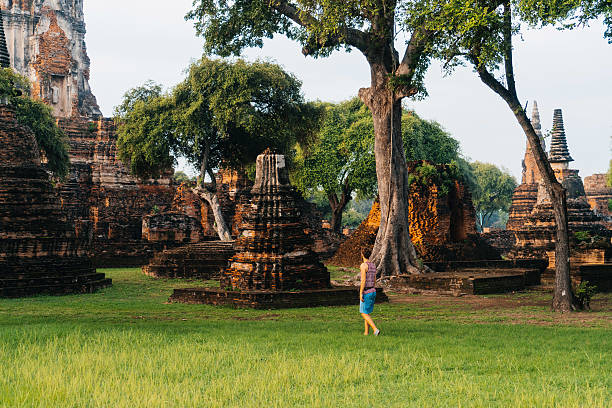 istock Man walking near ancient Buddhist Temples 620727972