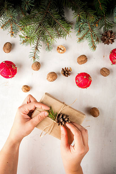 istock Girl decorates the gift in the Rustic style 620730166