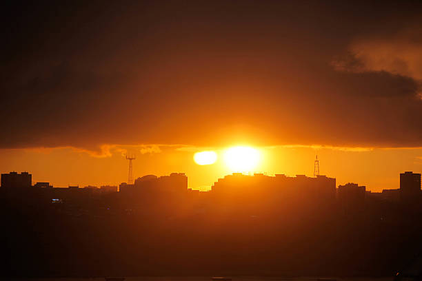 istock Beautiful sunset over silhouette city skyline 620730294