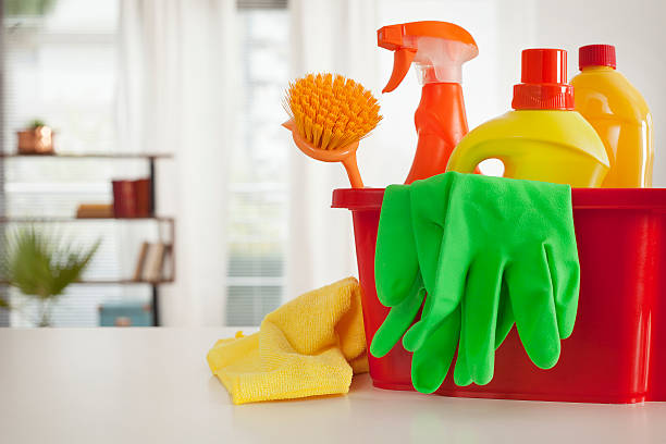 istock Plastic bucket with cleaning supplies in home 620730840