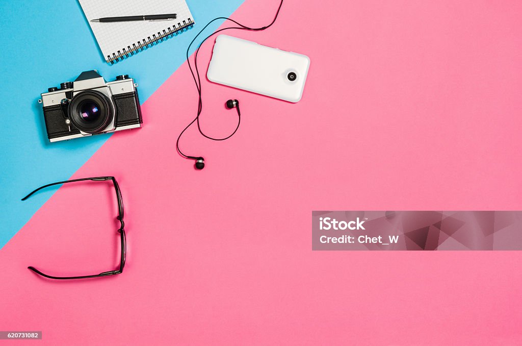 Flat lay photo of a creative freelancer woman workspace desk Flat lay photo of a creative freelancer woman workspace desk with copy space background. Image taken from above, top view. Minimal style with colorful paper backdrop Backgrounds Stock Photo