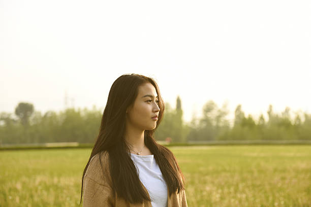 istock Young girl watching in a sunset 620731214