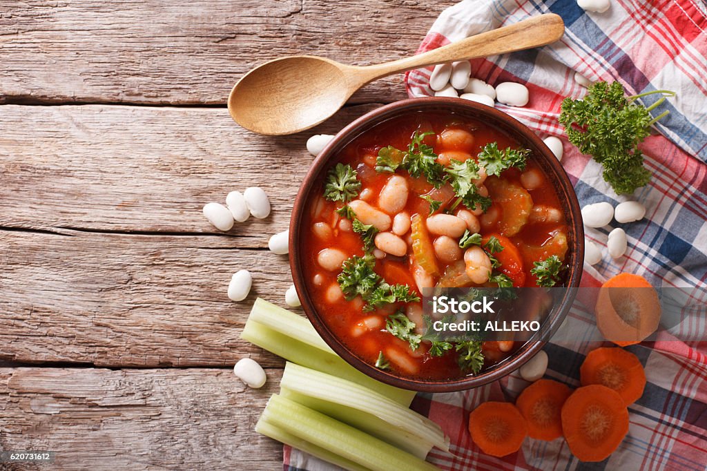 Rustic bean soup with ingredients. horizontal top view Homemade bean soup with ingredients. horizontal view from above Above Stock Photo