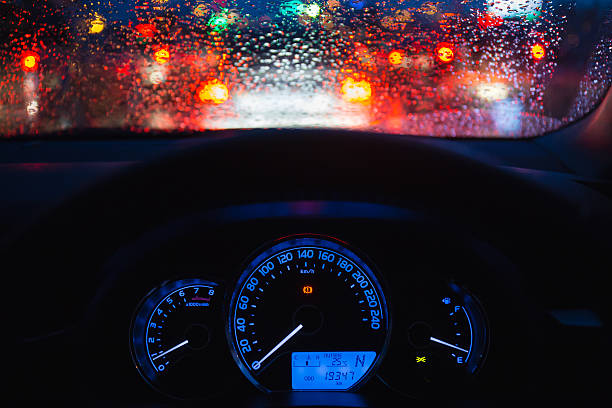 istock people driving modern car in night time 620732670