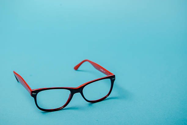 istock pair of red plastic-rimmed eyeglasses 620733684