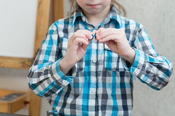 istock boy sculpts from plasticine at home 620734234
