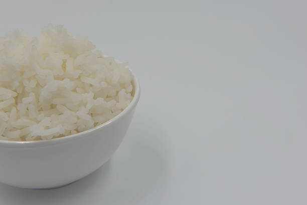 istock Cooked rice in a bowl on a white background. 620735274