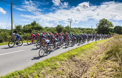 Quineville, France - July 2, 2016: The peloton riding during the first stage of Tour de France in Quineville, France on July 2, 2016.
