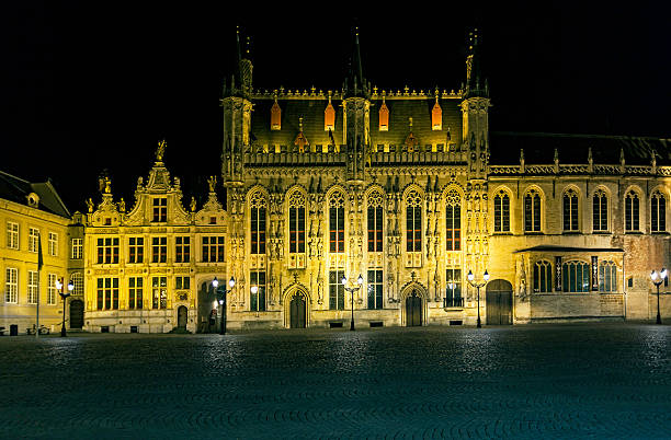 istock Medieval Brugge Stadhuis (City Hall) in Burg Square at night 620735886
