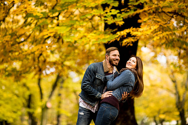 istock Young couple in the autumn park 620735992