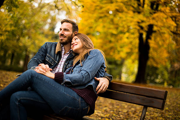 istock Young couple in the autumn park 620736020
