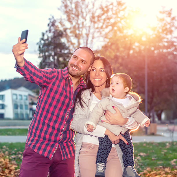 istock Happy family taking selfie 620736550