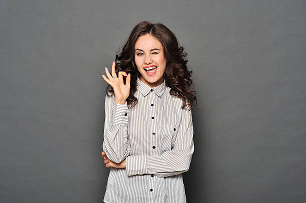 portrait of attractive brunette businesswoman - gesturing business looking at camera caucasian imagens e fotografias de stock