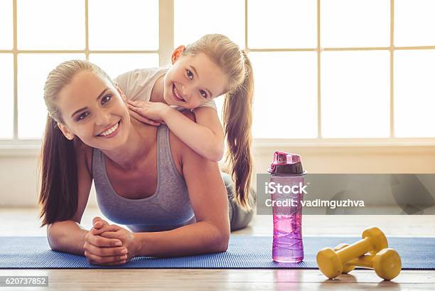 Mother And Daughter Doing Sport Stock Photo - Download Image Now - Mother, Exercising, Health Club