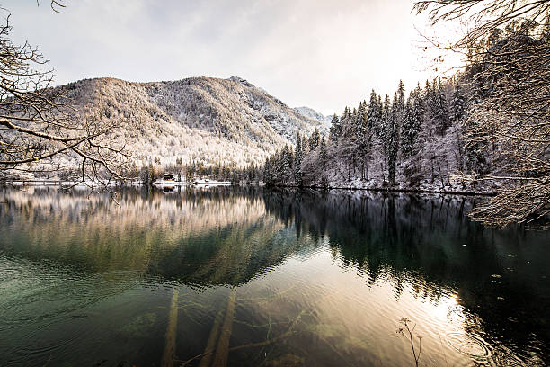 istock first snow at the mountain lake 620739296