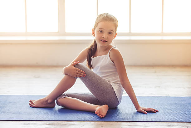 istock Little girl doing sport 620742380