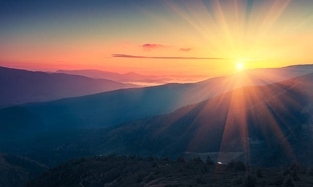 panoramic view of  colorful sunrise in mountains. - one point perspective imagens e fotografias de stock