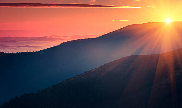 Panoramic view of  colorful sunrise in mountains. stock photo