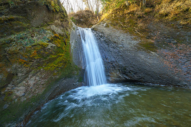 istock Waterfall in late autumn, Sakhalin Island, Russia. 620951538