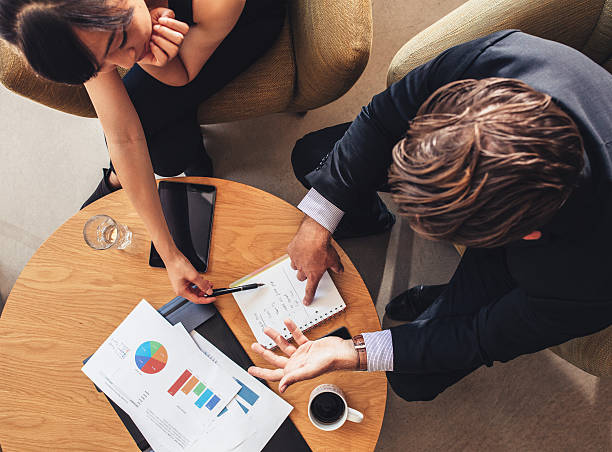 istock Coworkers discussing new business project 620951894