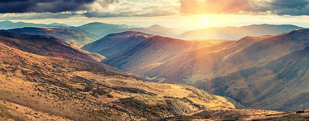 Panoramic view of autumn  mountains at sunshine. stock photo