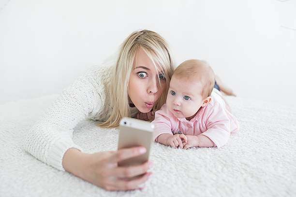 istock baby make selfie on mobile phone 620953246