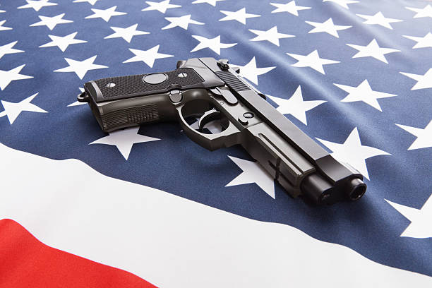 istock Flag with hand gun over it series - USA 620953546
