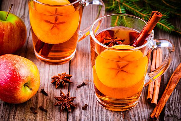 istock Mulled apple cider with cinnamon and anis in glass mugs 620953866