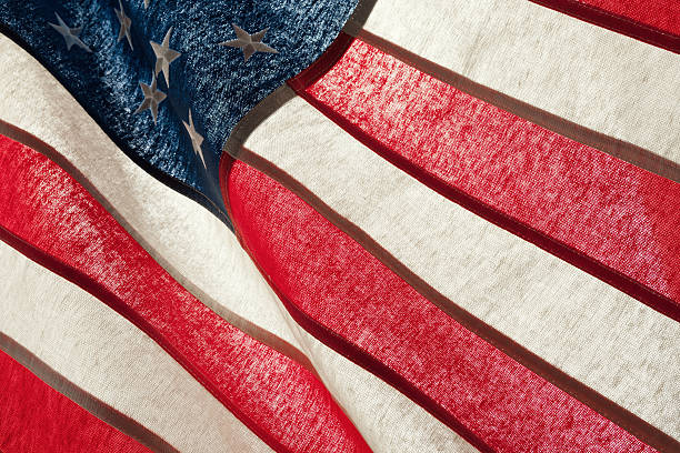 istock Series of ruffled flags against sun - USA 620955098