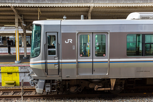 kyoto, Japan - June 5, 2016: Train waiting at a station for people to get to work