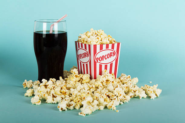 istock Popcorn bucket against a blue background 620957740