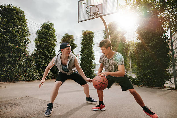 istock Two young men having a game of basketball 620958698
