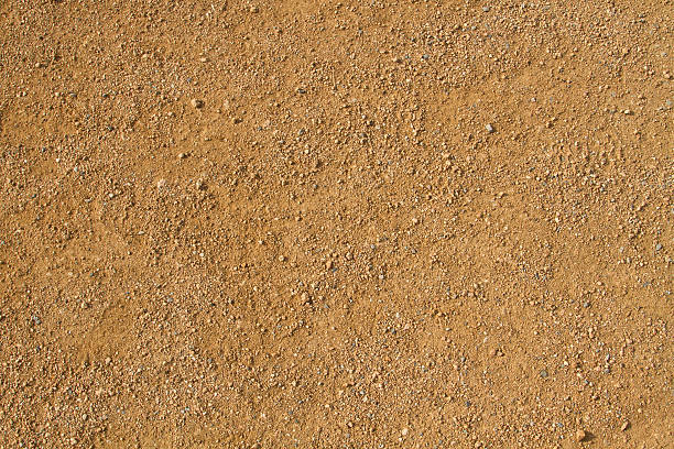 istock Dry dirty brown  ground with small stones 620962428