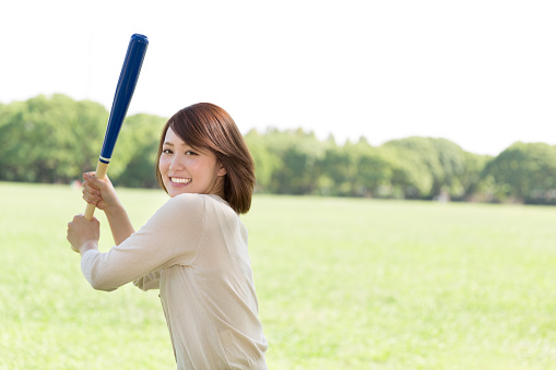 Japanese woman playing baseball