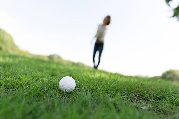 istock Japanese woman playing golf 620963206