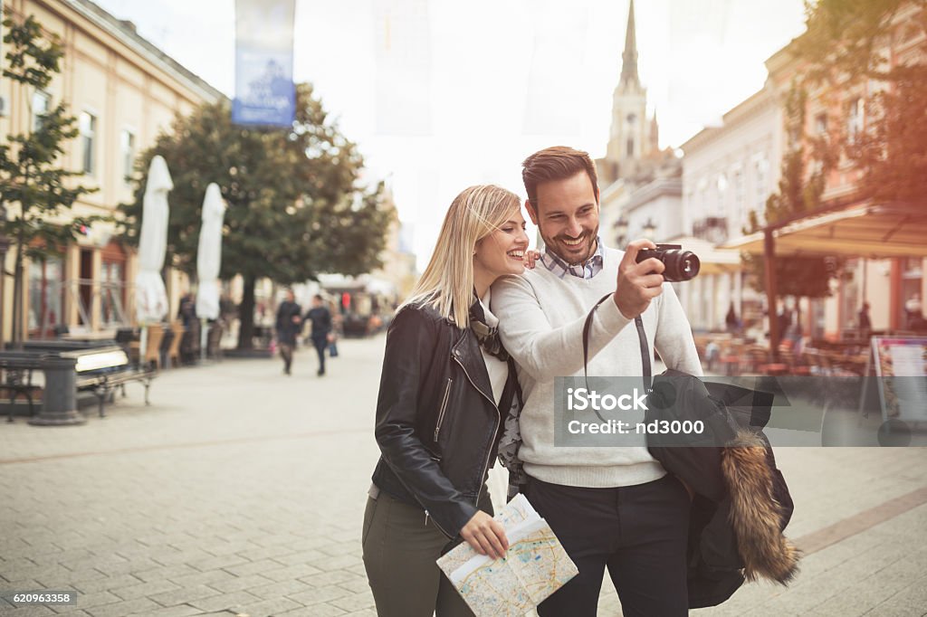 Tourist couple enjoying sightseeing Tourist couple enjoying sightseeing and exploring city City Stock Photo