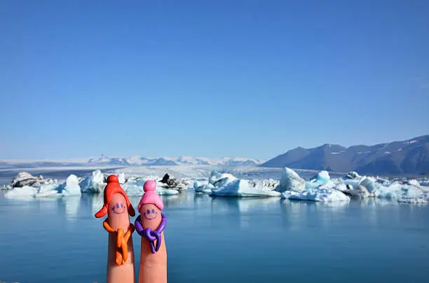 I created happy people by furnishing my fingers with play dough, in front of a glacier in iceland.