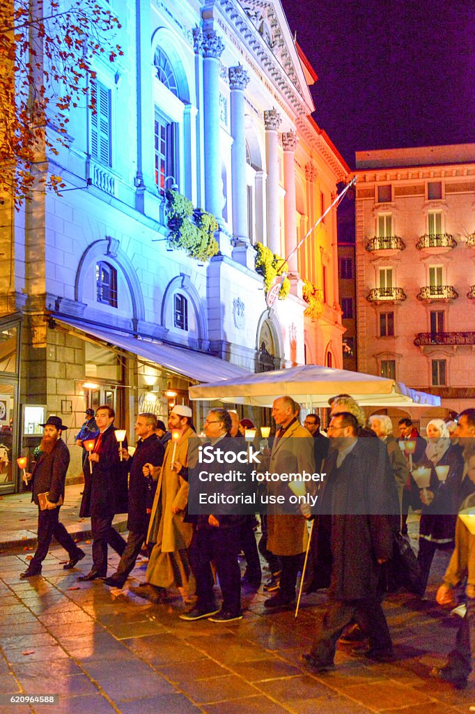 Group of people during the interfaith procession Lugano, Switzerland - 17 novembre 2015: group of people during the interfaith procession against terrorism in the streets of Lugano on Switzerland Abstract Stock Photo