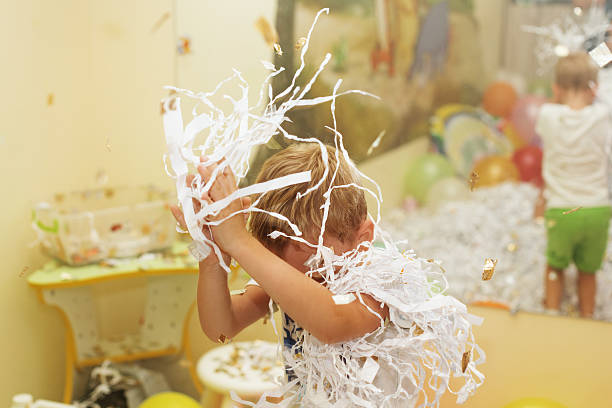 istock Little boy jumping and having fun celebrating birthday. 620965144