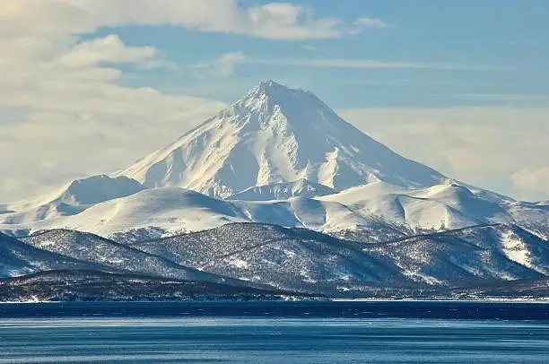 Volcano with snow in winter day